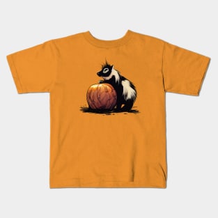 Baby skunk on a pumpkin Kids T-Shirt